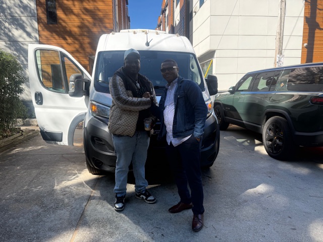 Josh and driver Vaughn beside a Noel cargo van